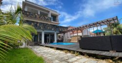 Location d’un superbe appartement avec piscine commune offrant vue imprenable sur mer et montagne à Calodyne